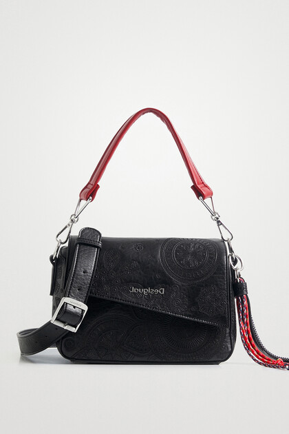 Handbag flap asymmetric