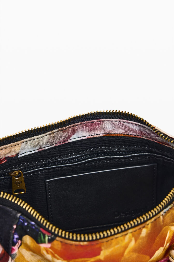 small printed M. C. Lacroix bag