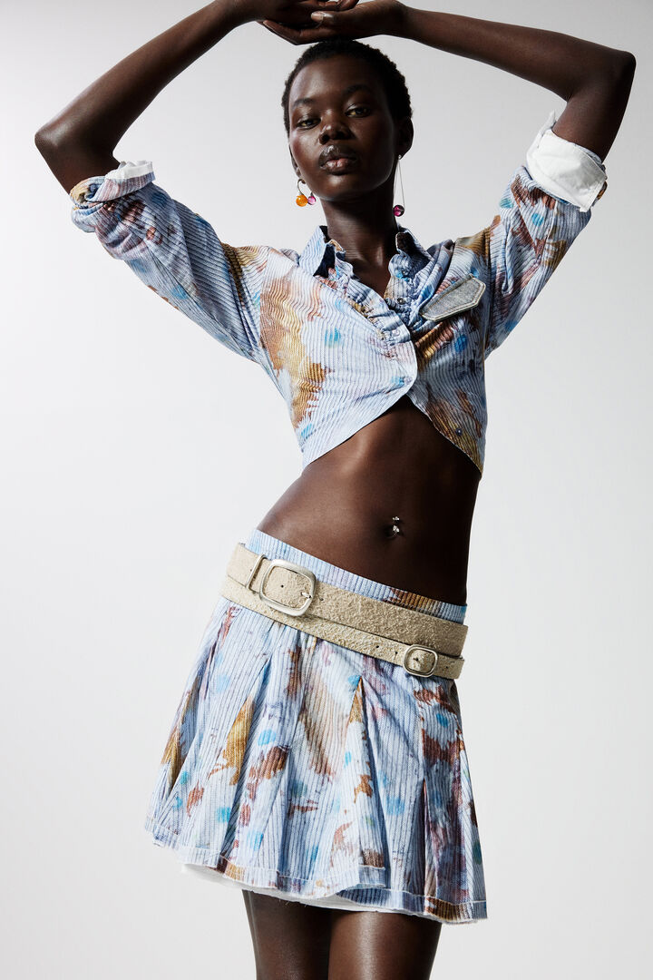 Jupe mini plissée à fleurs | Desigual