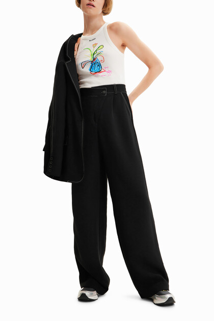 Twisted trousers with pleats
