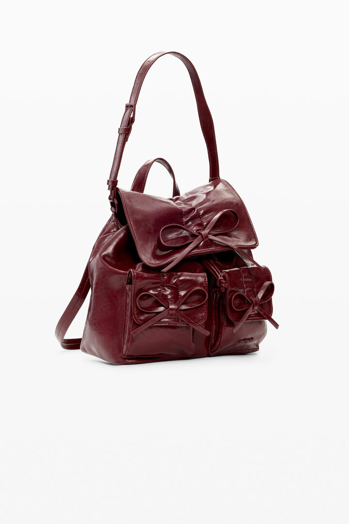 Small shiny backpack with bow | Desigual