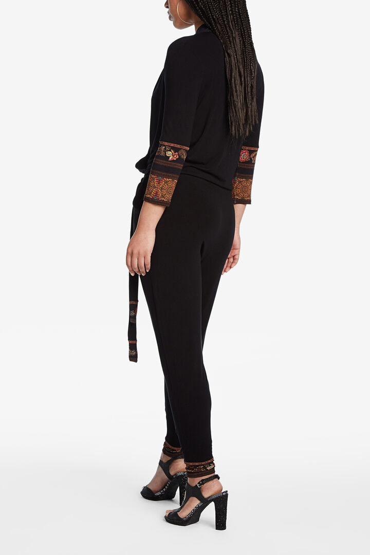 Black jumpsuit with ethnic frieze pattern details | Desigual
