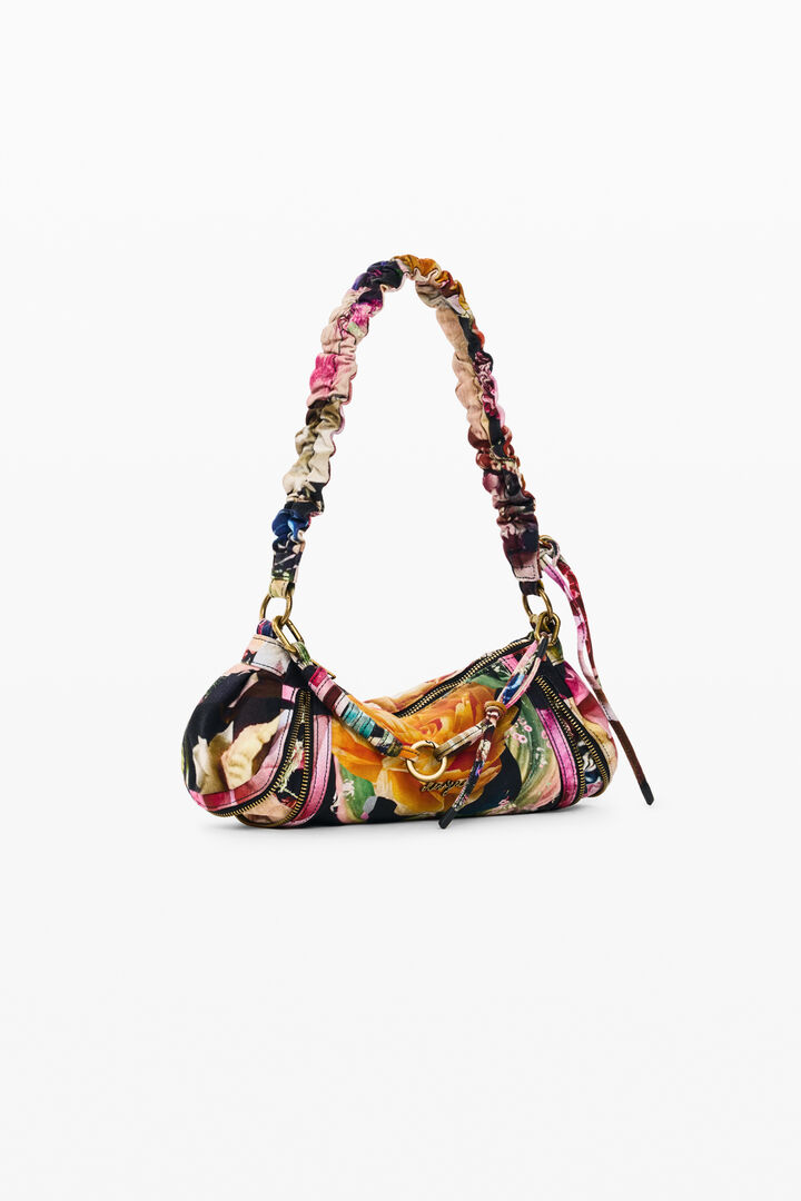small printed M. C. Lacroix bag