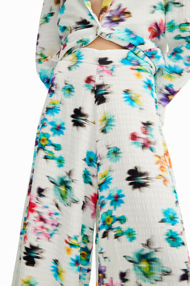 Pantalón maxi flores desenfocadas | Desigual