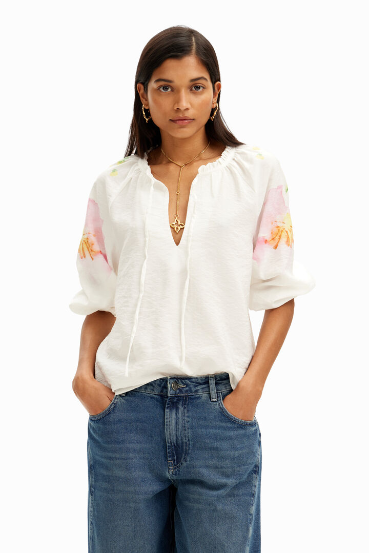 Flowy blouse with watercolor floral print.