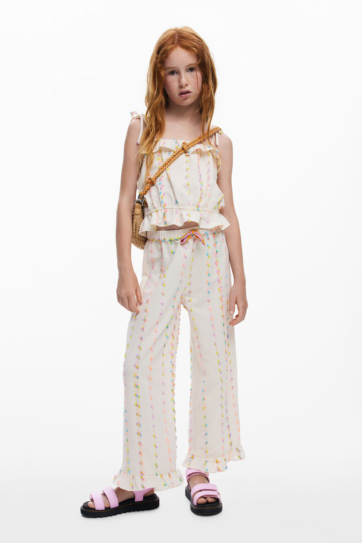 Long pants with pom-poms | Desigual