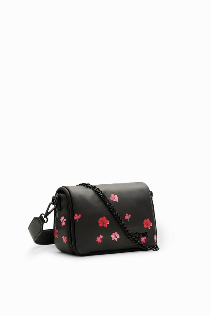 S podložena torbica z rožastim vzorcem