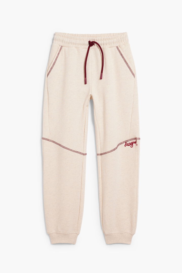 Elastic waistband trousers with seams