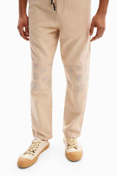 Trousers with floral details | Desigual
