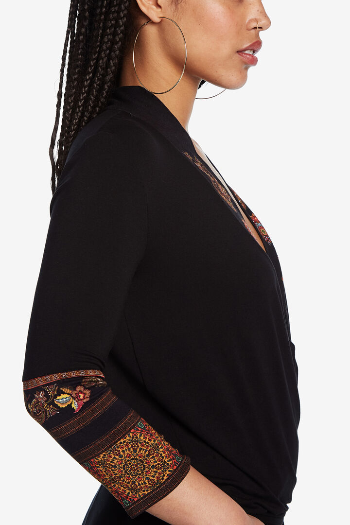 Black jumpsuit with ethnic frieze pattern details | Desigual