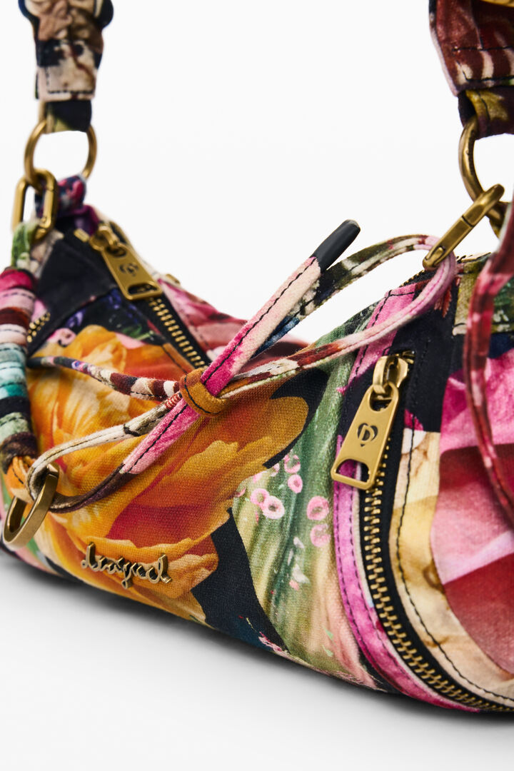 small printed M. C. Lacroix bag