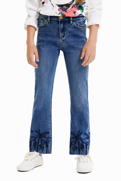 Lange flared jeans met borduursels