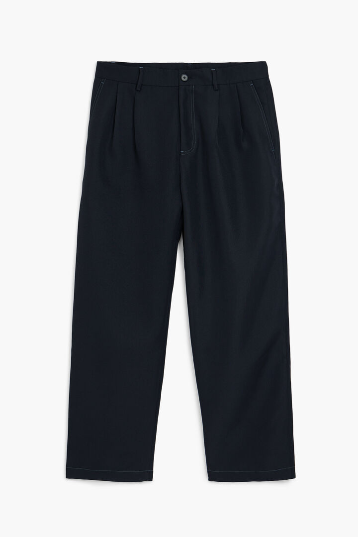 Pantaloni a pieghe con contrasti | Desigual