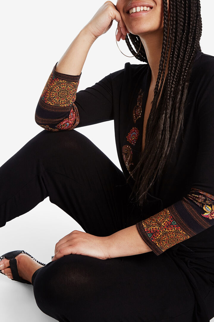 Black jumpsuit with ethnic frieze pattern details | Desigual
