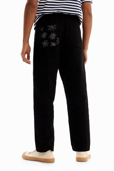 Trousers with floral details | Desigual