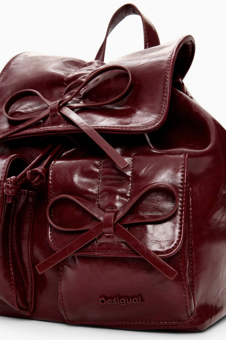Mochila pequeña brillante lazo | Desigual