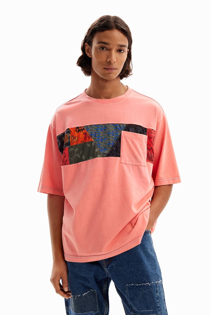 T-shirt with cutouts and pocket.