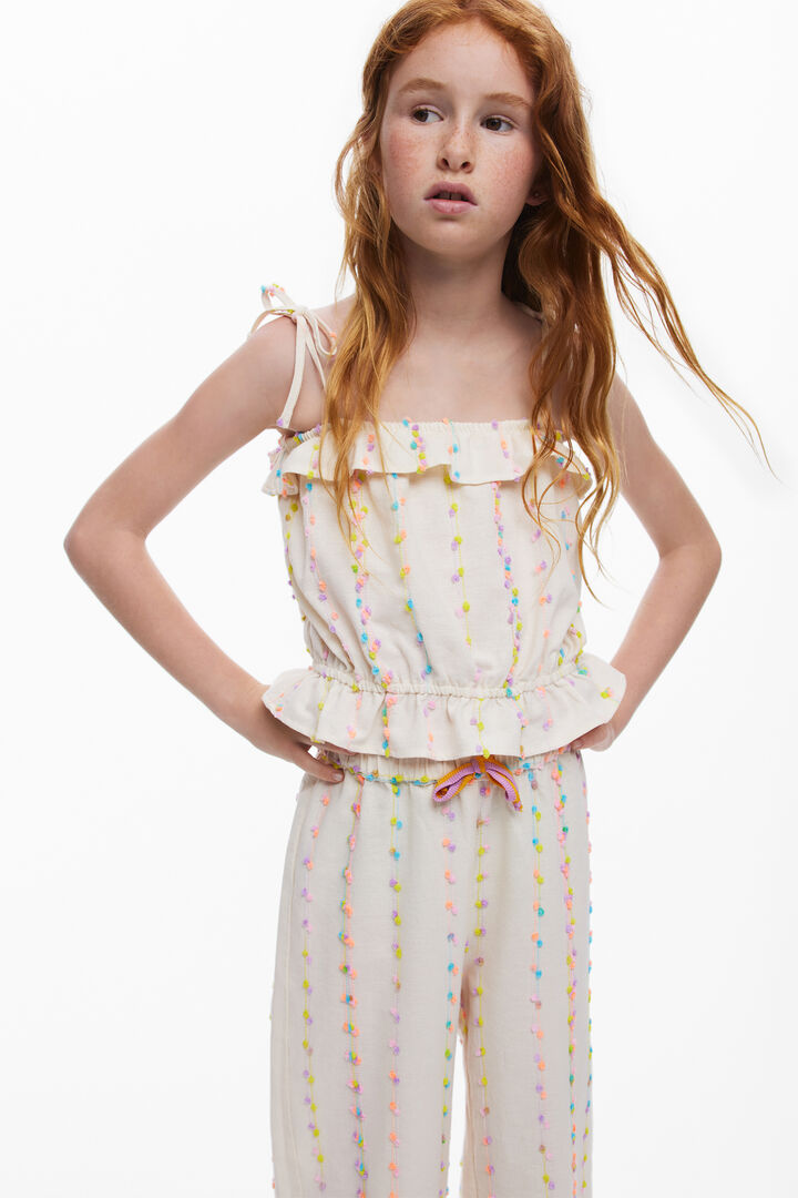 Long pants with pom-poms | Desigual