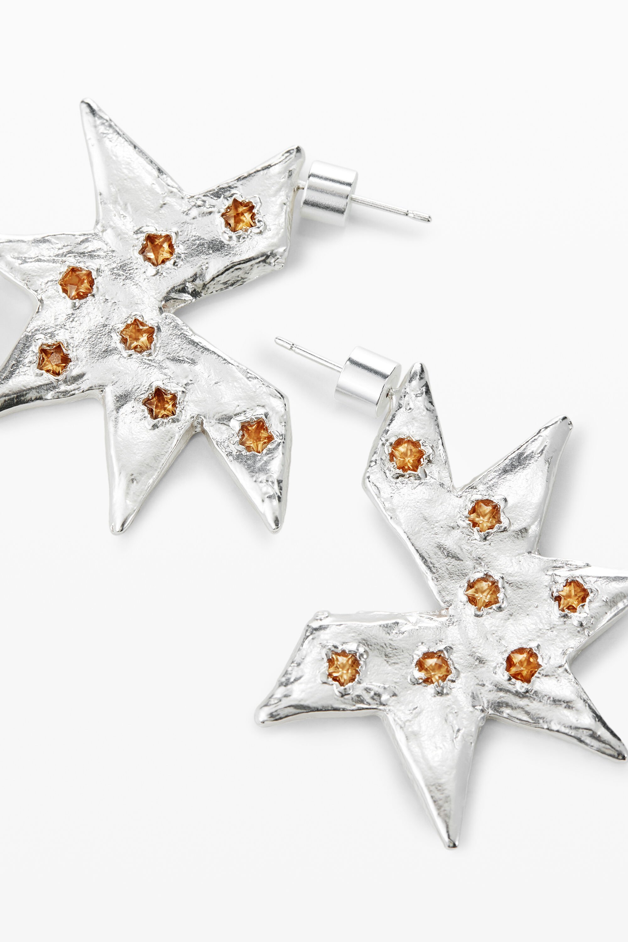 Star shaped silver earrings online