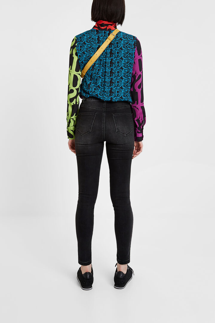 Skinny jeans with side strip and sequin details | Desigual