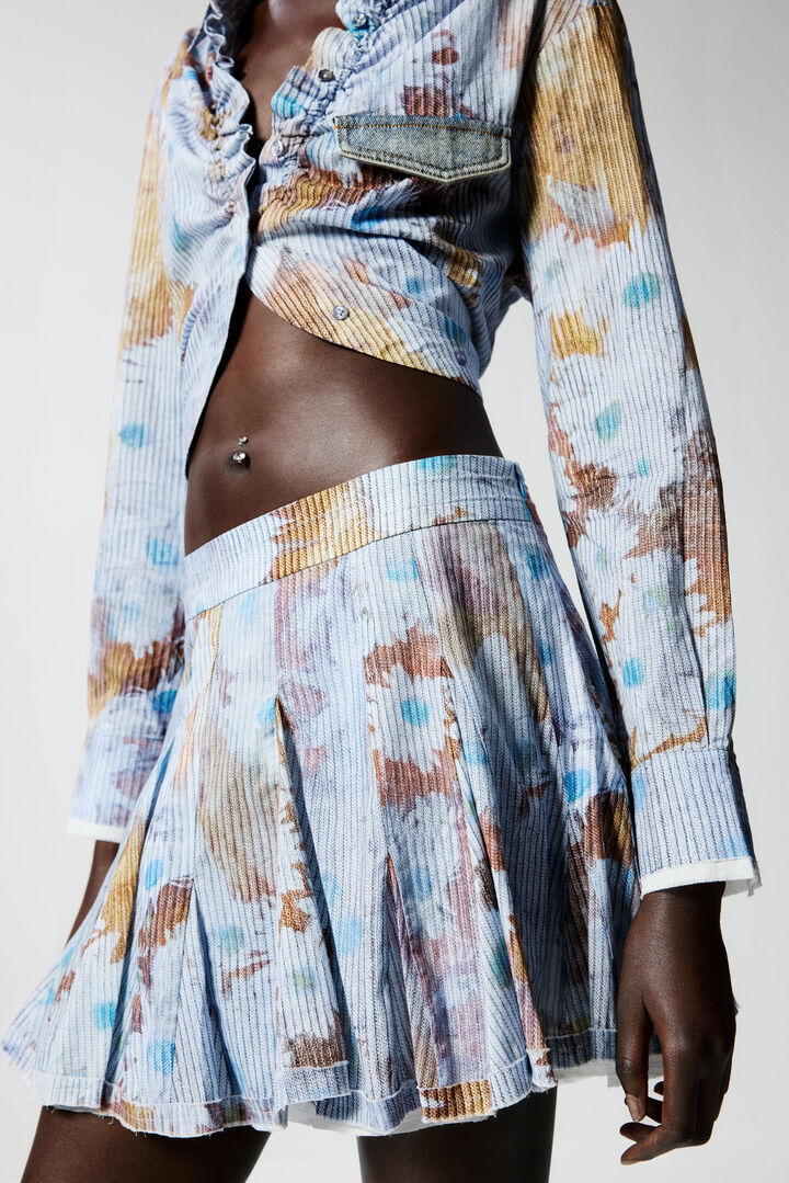 Jupe mini plissée à fleurs | Desigual