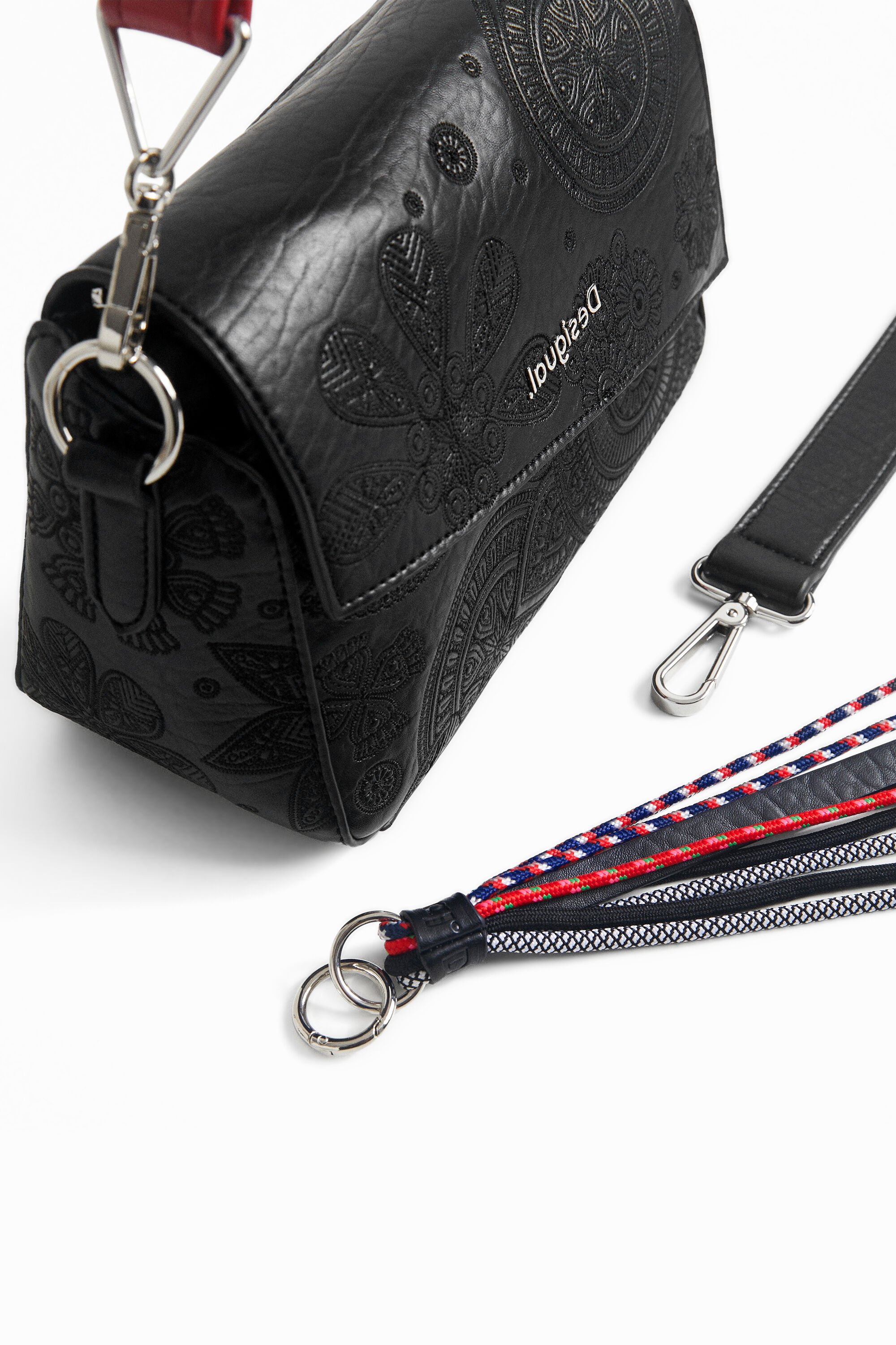 Handbag flap asymmetric