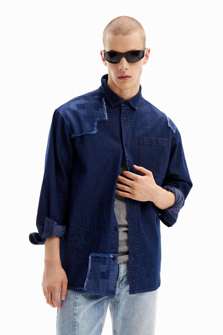 Denim shirt with embroidery and patches.