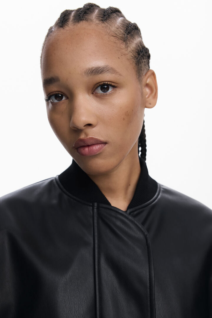 Poncho effet cuir à reliefs | Desigual