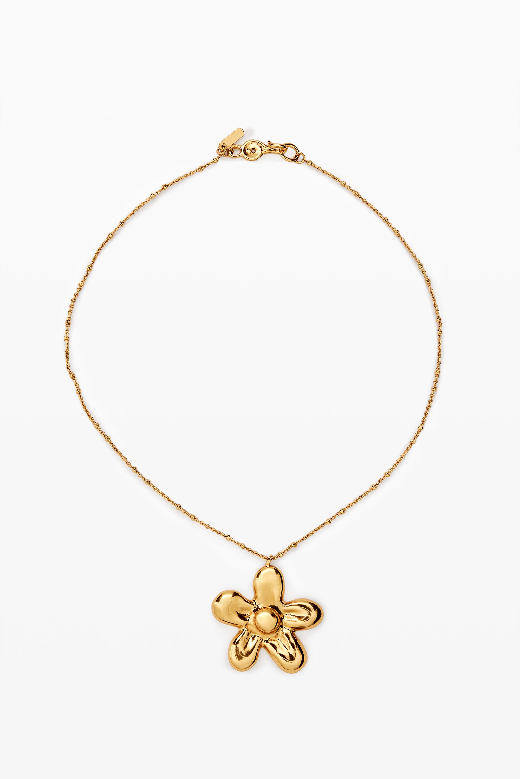 Colgante flor pequeña zalio, U