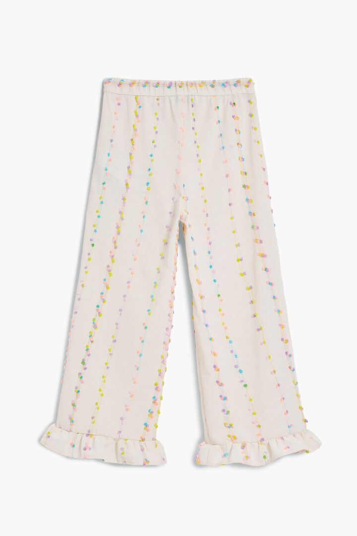 Long pants with pom-poms | Desigual