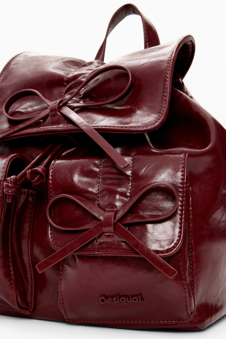 Small shiny backpack with bow | Desigual